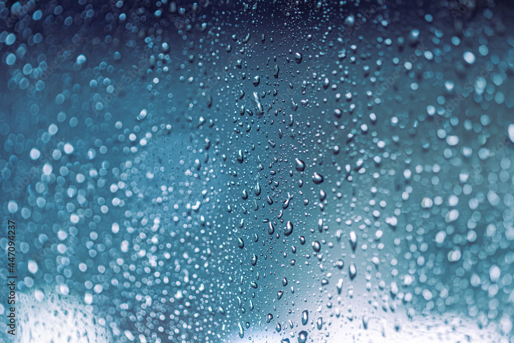 Rain drops on the window, rainy night with cool lights. Drop pattern. Rain drops on the window, rainy night with cool lights. Drop pattern.