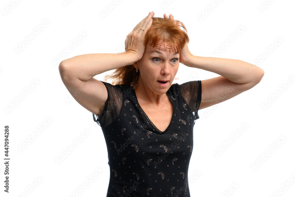 High resolution portrait of an adult red-haired woman showing emotional surprise with her hands. Isolate on white background