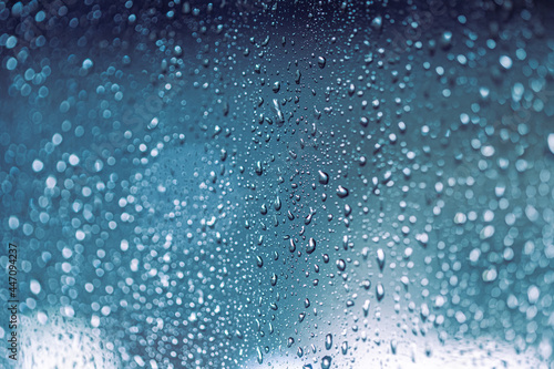 Rain drops on the window, rainy night with cool lights. Drop pattern.