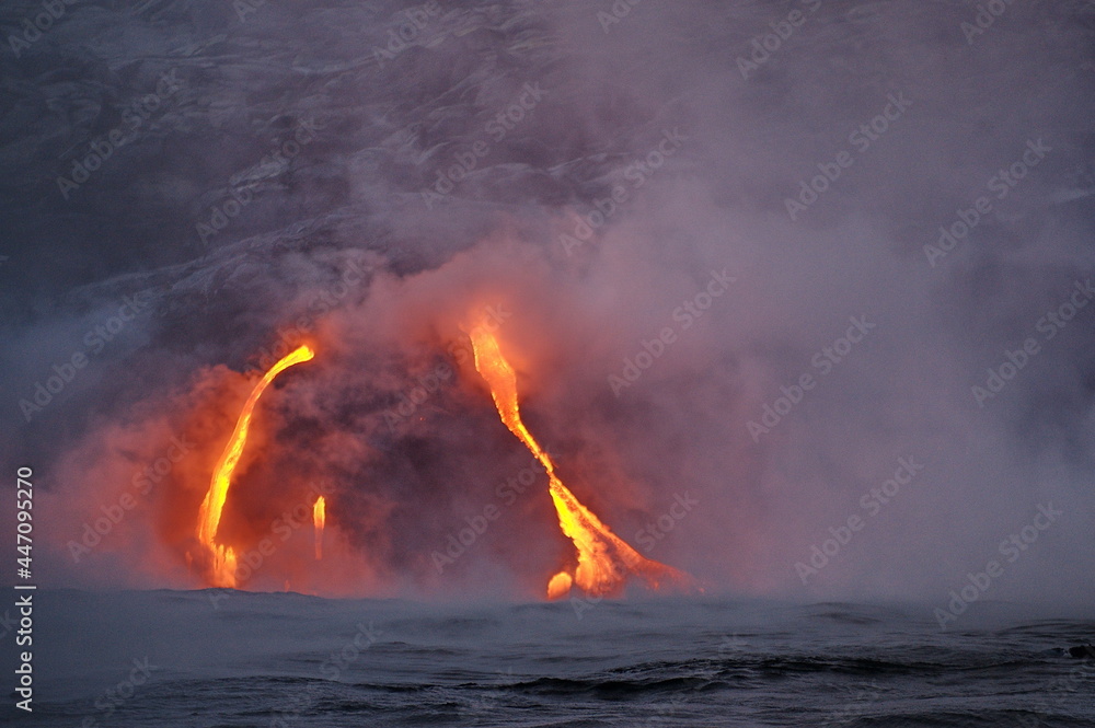 Hawaii. Volcanic eruption. Fiery lava flows into the ocean