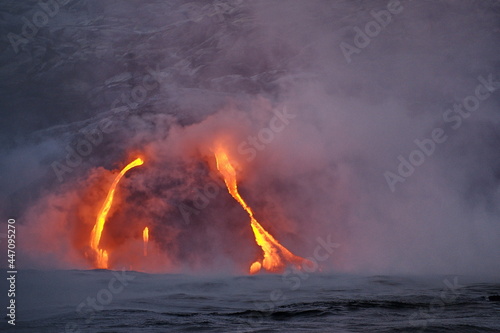 Hawaii. Volcanic eruption. Fiery lava flows into the ocean