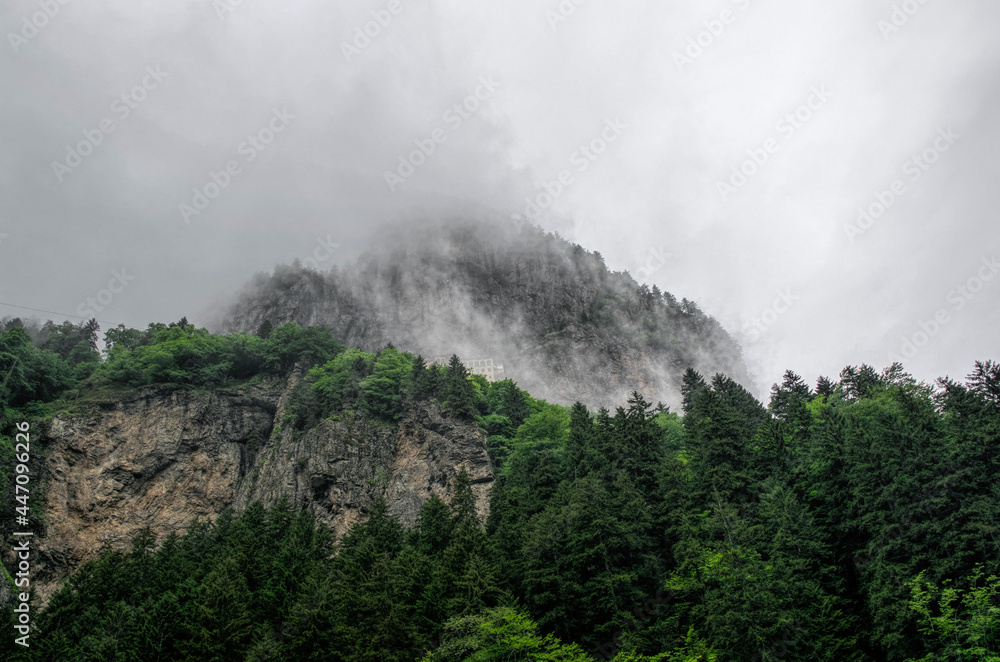 Misty mountain peaks and ancient Sumela Monastery in Trabzon, Turkey