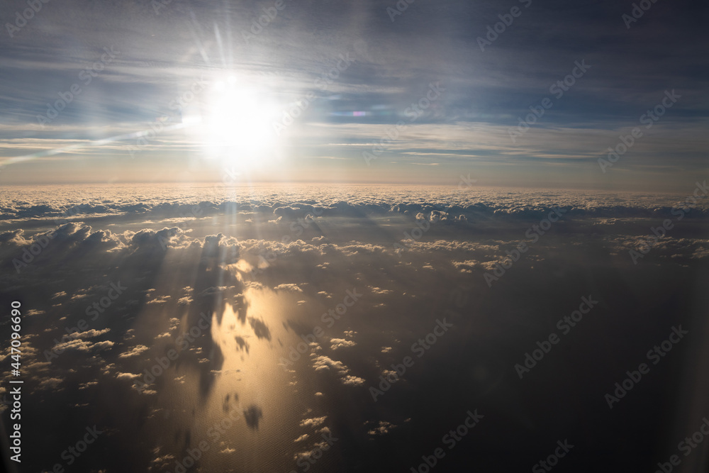 Aerial view of magic clouds during sunrise, shadow of clouds on the sea, sky view 