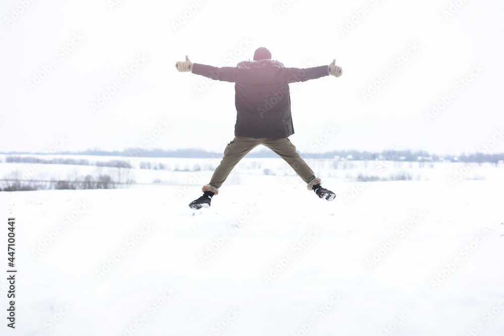 Outdoor portrait of handsome man in coat and scurf. Bearded man in the winter woods. Outdoor portrait of handsome man in coat and scurf. Bearded man in the winter woods.