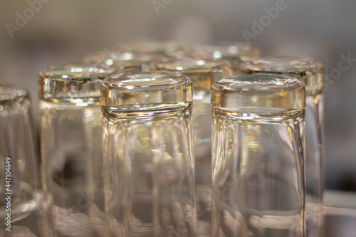Close up empty glasses in restaurant natural light. selective focus and blur background.