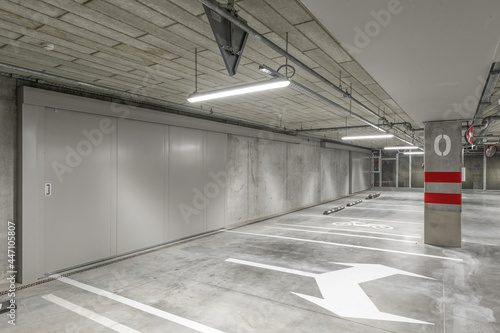 Wallpaper Mural Empty public underground parking lot or garage interior with concrete stripe painted columns and signs Torontodigital.ca