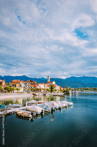Feriolo  Verbania   Italy - June 2021  Feriolo village on Lake Maggiore with cloudy sky with small boats moored in the foreground