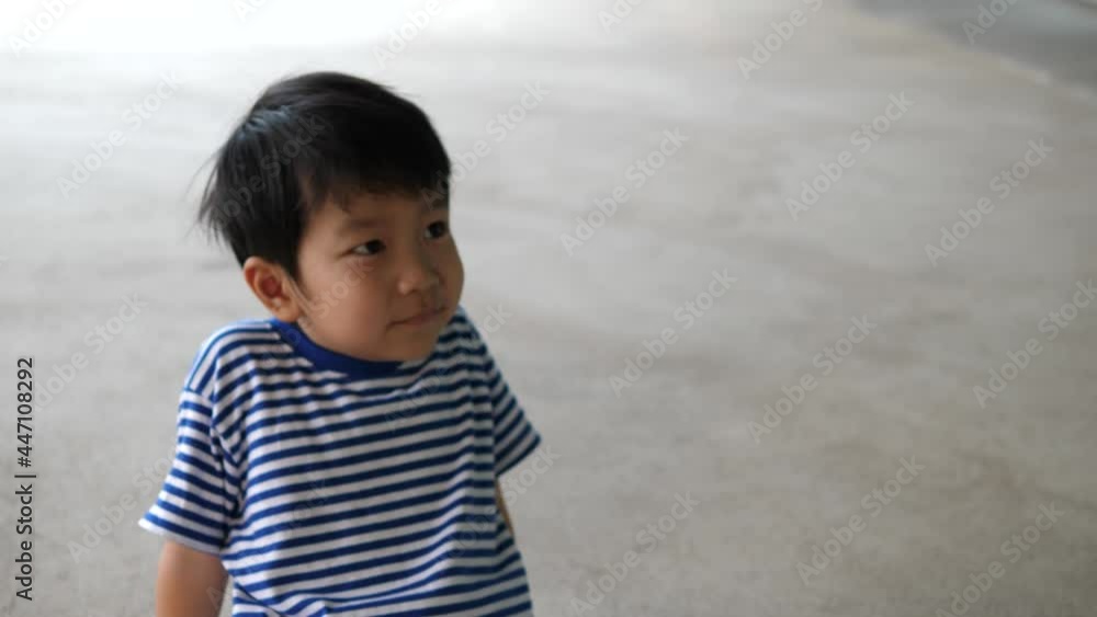 Asian child boy showing hands and fingers gesture like traffic lights sign while playing with happy smile at home. Concept of family fun activity, happy relax moment. Asian child boy showing hands and fingers gesture like traffic lights sign while playing with happy smile at home. Concept of family fun activity, happy relax moment.