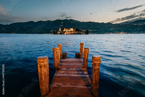 Fototapeta Naklejka Na Ścianę i Meble -  Orta San Giulio / Italy - June 2021: The island of San Giulio at sunset (blue hour)