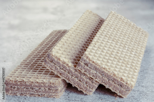 Delicious wafer sticks with chocolate on background. Selective focus. photo