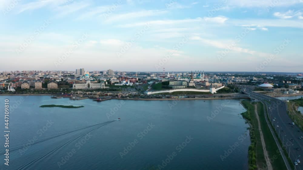 Flight over Kazan in the evening. View from the top of the Volga River. Shooting from a drone to a ship sailing along the river Flight over Kazan in the evening. View from the top of the Volga River. Shooting from a drone to a ship sailing along the river