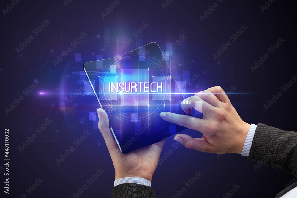 Businessman holding a foldable smartphone Businessman holding a foldable smartphone