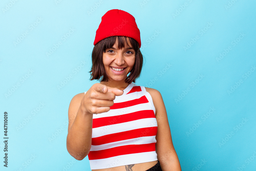 Young mixed race woman isolated on blue background pointing to front with fingers. Young mixed race woman isolated on blue background pointing to front with fingers.