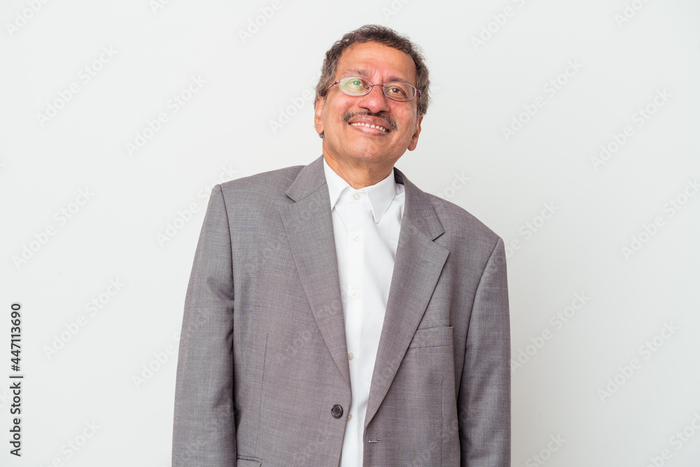 Middle aged indian business man isolated on white background dreaming of achieving goals and purposes Middle aged indian business man isolated on white background dreaming of achieving goals and purposes