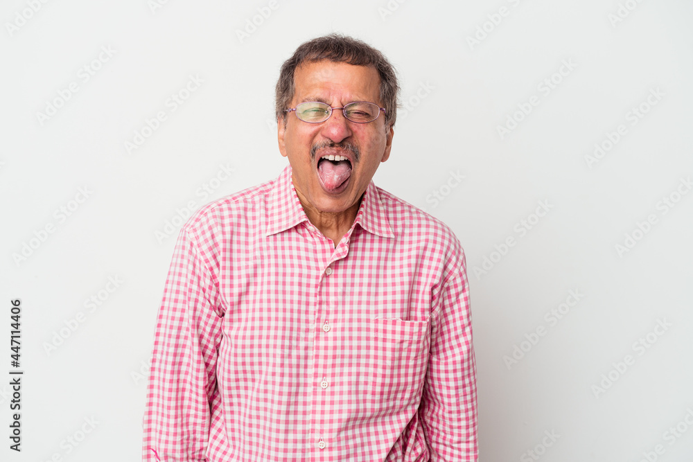 Middle aged indian man isolated on white background funny and friendly sticking out tongue. Middle aged indian man isolated on white background funny and friendly sticking out tongue.