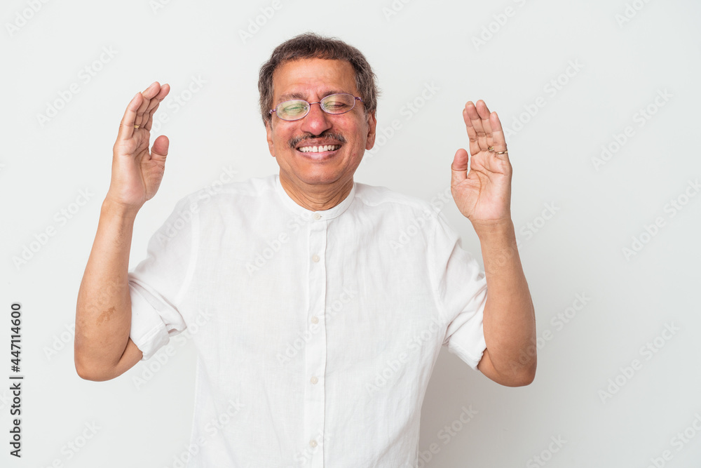 Middle aged indian man isolated on white background joyful laughing a lot. Happiness concept. Middle aged indian man isolated on white background joyful laughing a lot. Happiness concept.