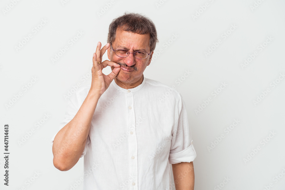 Middle aged indian man isolated on white background with fingers on lips keeping a secret. Middle aged indian man isolated on white background with fingers on lips keeping a secret.