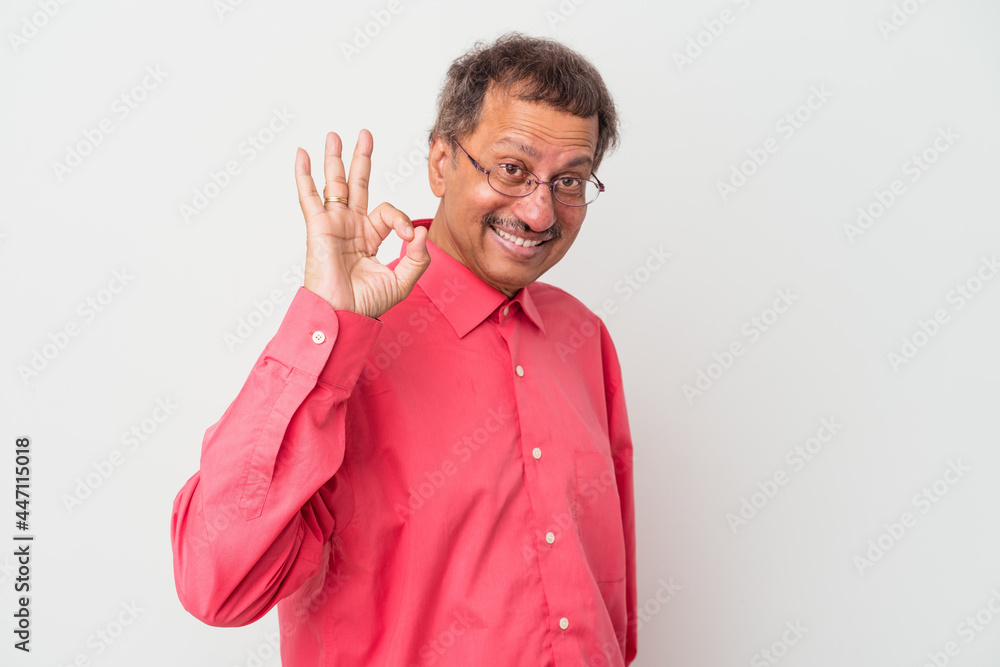Middle aged indian man isolated on white background cheerful and confident showing ok gesture. Middle aged indian man isolated on white background cheerful and confident showing ok gesture.