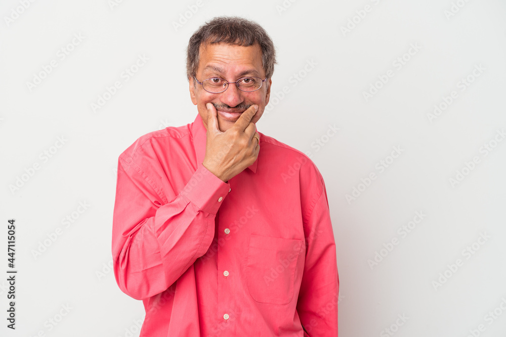 Middle aged indian man isolated on white background doubting between two options. Middle aged indian man isolated on white background doubting between two options.