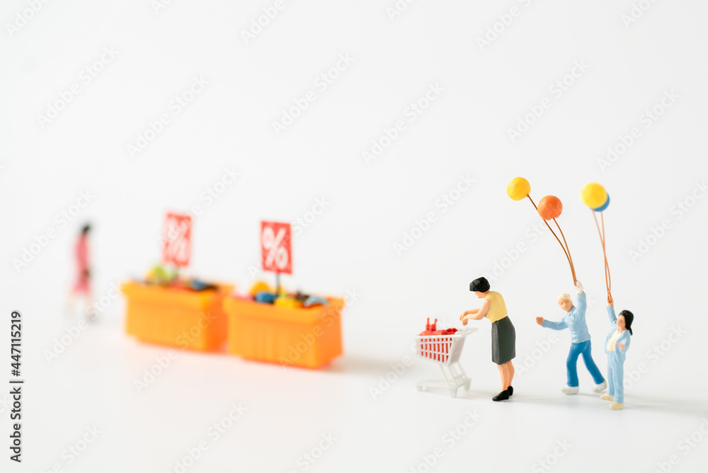 Miniature people Family Father Mother and children go shopping buying supplies supermarket mart grocery things using for internet online marketing Credit Card spending money department store business Miniature people Family Father Mother and children go shopping buying supplies supermarket mart grocery things using for internet online marketing Credit Card spending money department store business