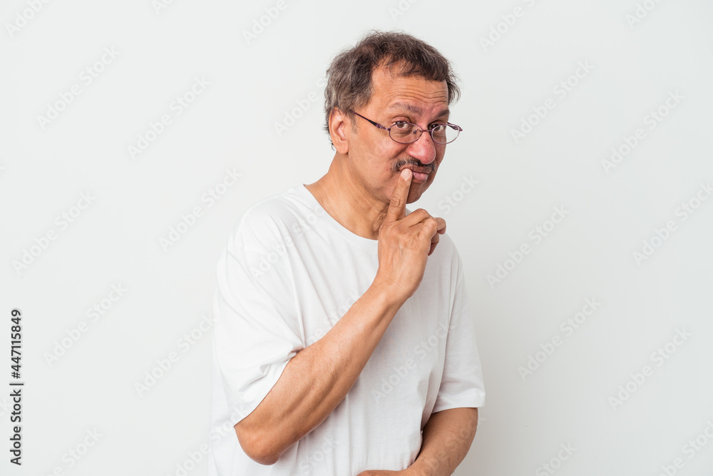 Middle aged indian man isolated on white background contemplating, planning a strategy, thinking about the way of a business. Middle aged indian man isolated on white background contemplating, planning a strategy, thinking about the way of a business.
