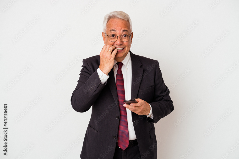 Senior business american man holding mobile phone isolated on white background biting fingernails, nervous and very anxious. Senior business american man holding mobile phone isolated on white background biting fingernails, nervous and very anxious.