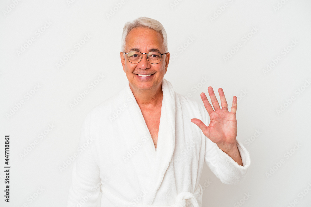 Senior american man wearing bathrobe isolated on white background smiling cheerful showing number five with fingers. Senior american man wearing bathrobe isolated on white background smiling cheerful showing number five with fingers.
