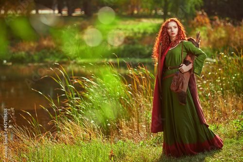 redhead beauty with quiver photo