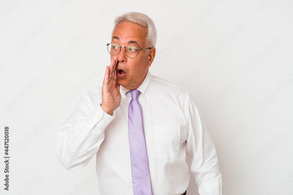 Senior american man isolated on white background is saying a secret hot braking news and looking aside Senior american man isolated on white background is saying a secret hot braking news and looking aside