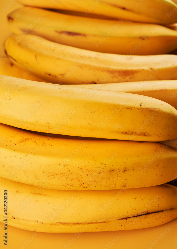 Yellow whole bananas close up background