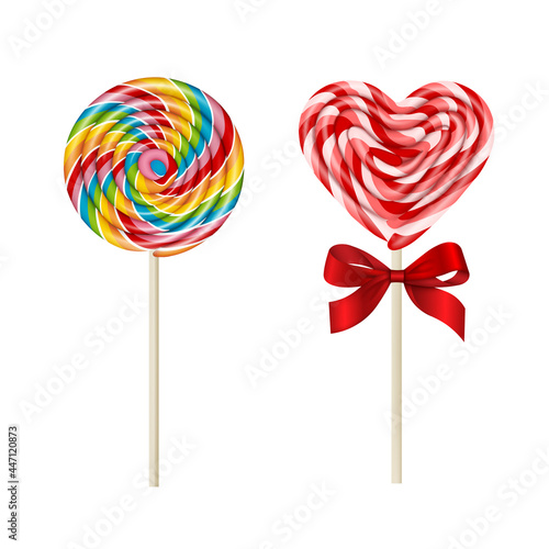 isolated colorful lollipops. rainbow lollipop and heart-shaped lollipop with red bow