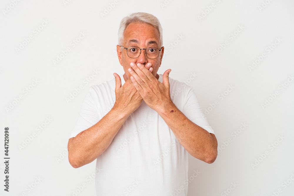 Senior american man isolated on white background shocked, covering mouth with hands, anxious to discover something new. Senior american man isolated on white background shocked, covering mouth with hands, anxious to discover something new.
