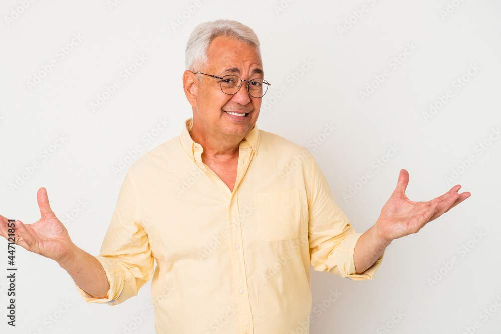 Senior american man isolated on white background doubting and shrugging shoulders in questioning gesture. Senior american man isolated on white background doubting and shrugging shoulders in questioning gesture.