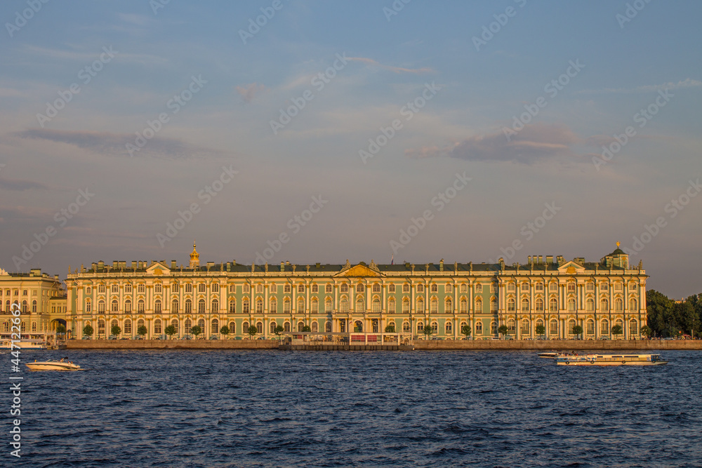 panoramic view of the Hermitage Winter Palace-Museum and the Neva River at sunset on a sunny summer evening and a copy space in Saint-Petersburg Russia