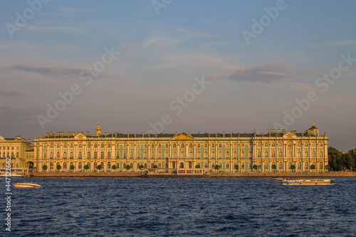 panoramic view of the Hermitage Winter Palace-Museum and the Neva River at sunset on a sunny summer evening and a copy space in Saint-Petersburg Russia