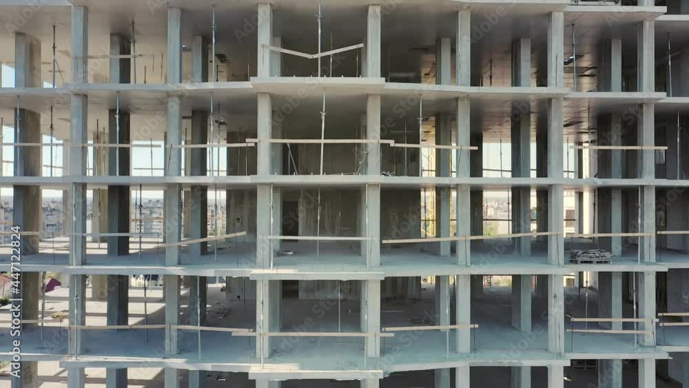 Aerial view of high residential apartment building under construction. Real estate development. Aerial view of high residential apartment building under construction. Real estate development.