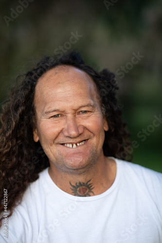 head and shoulders photo of man smiling at camera