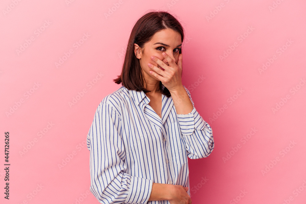 Young caucasian woman isolated on pink background scared and afraid. Young caucasian woman isolated on pink background scared and afraid.