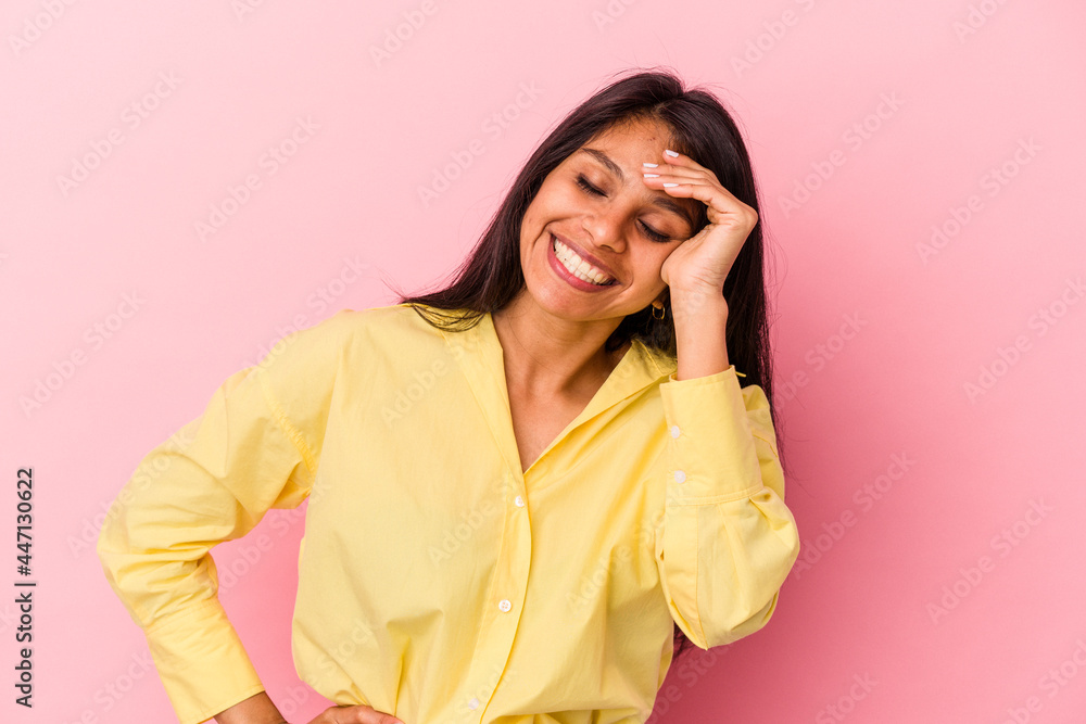 Young latin woman isolated on pink background joyful laughing a lot. Happiness concept. Young latin woman isolated on pink background joyful laughing a lot. Happiness concept.
