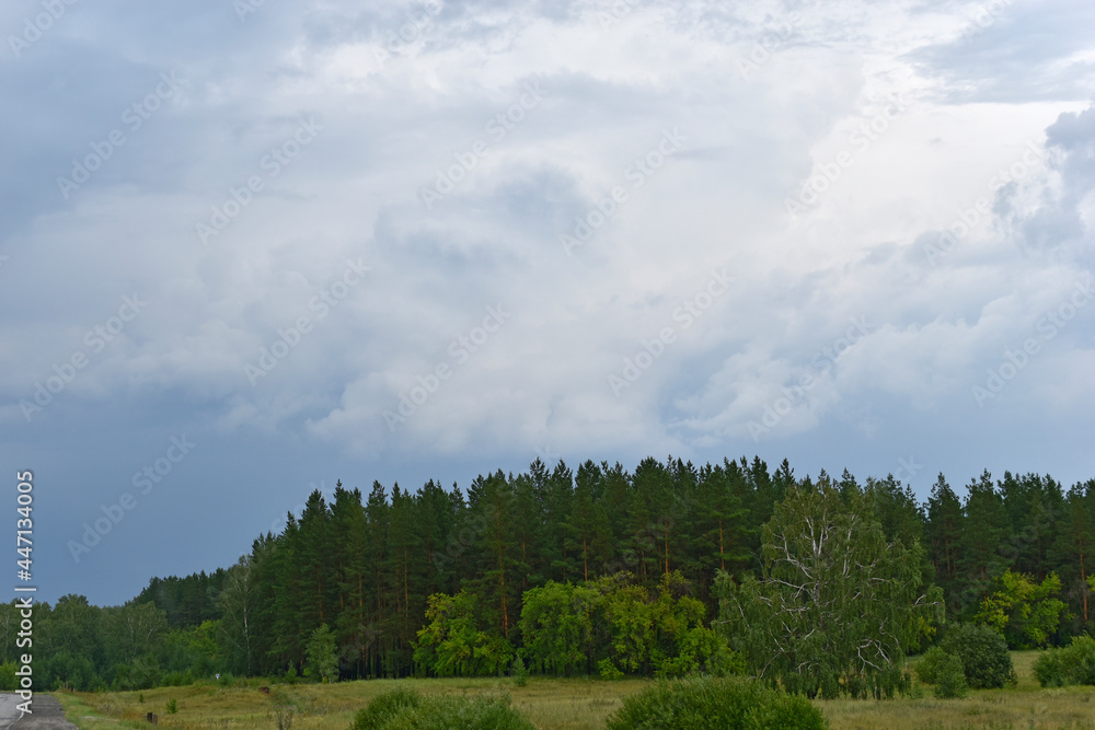 Stormy landscape in the countryside with clouds Stormy landscape in the countryside with clouds