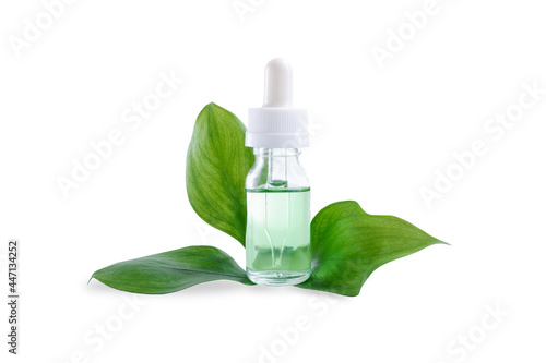 green liquid in a glass bottle