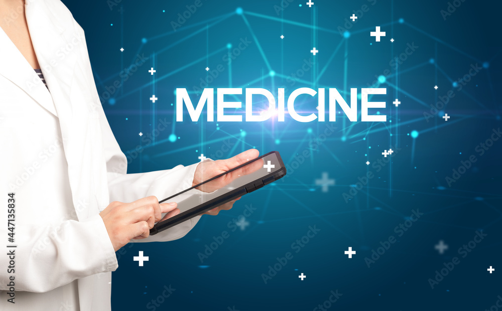 Doctor fills out medical record Doctor fills out medical record