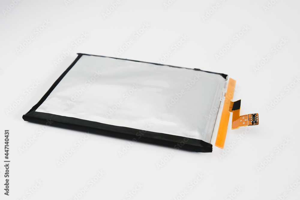 Rechargeable Li-ion battery for smartphone on background. Rechargeable Li-ion battery for smartphone on background.