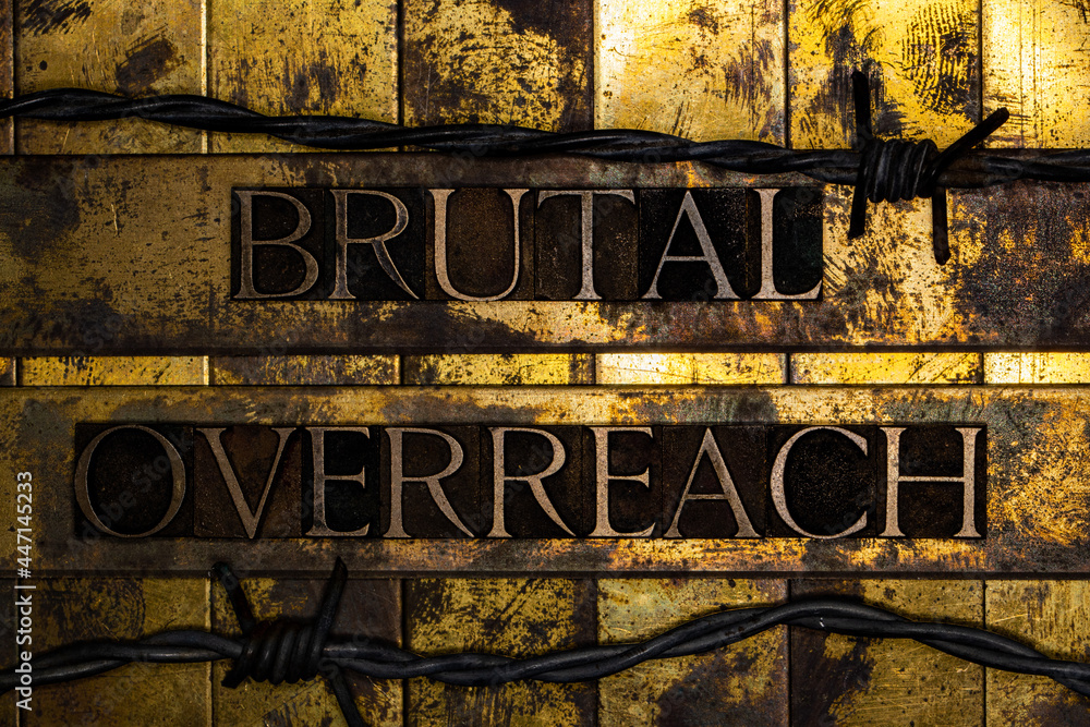 Brutal Overreach text message on grunge textured gold and copper background