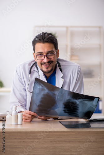 Young male doctor radiologist working in the clinic