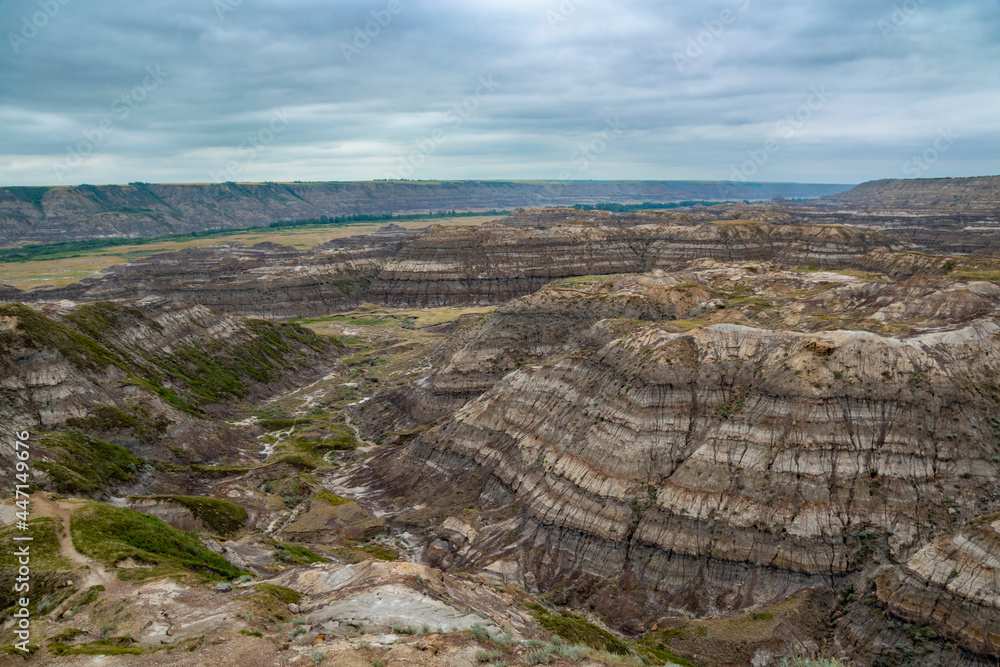 A stark view of Horsethief Canyon, part of the Alberta badlands on Dinosaur Trail near Drumheller, Alberta on a dark and gloomy day.