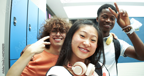 Obraz na plátne POV of Three multi-ethnic teenage students take a selfie at school