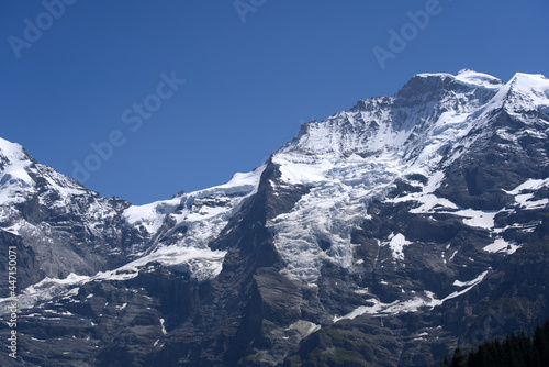 Jungfraujoch with research station Sphinx at Bernese highland on a sunny summer day with blue sky background. Photo taken July 20th, 2021, Lauterbrunnen, Switzerland.