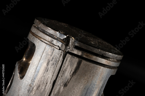 Old Broken Engine Piston Isolated On Black Background