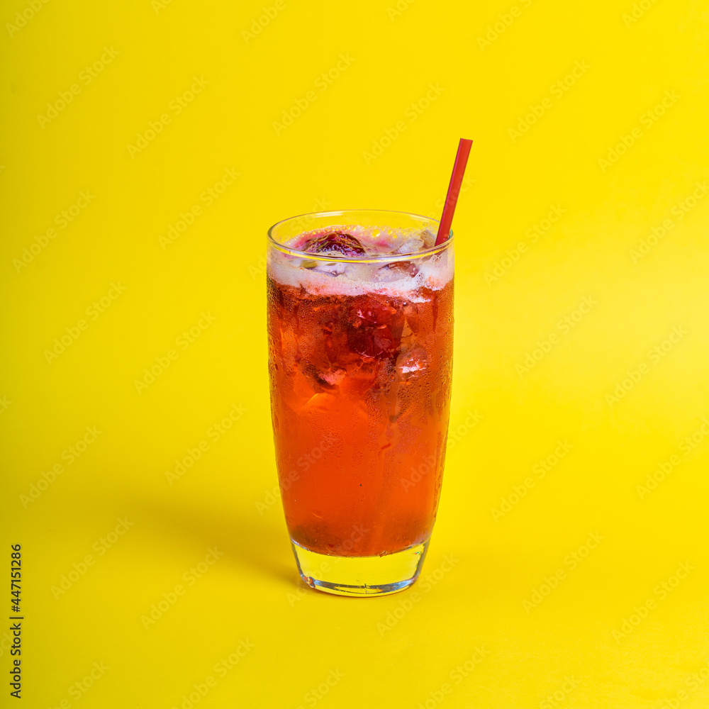 red fresh cocktail smoothie jusice in glass with ice on yellow background. vitamin drink detox red fresh cocktail smoothie jusice in glass with ice on yellow background. vitamin drink detox